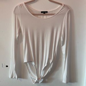 a white body suit with long sleeves